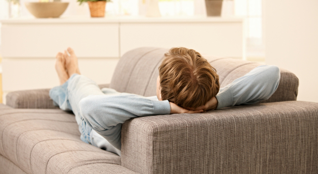 Man lying on sofa
